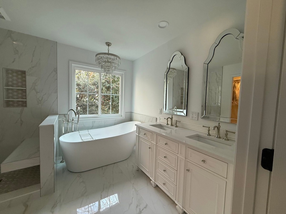 Marble primary bathroom after remodeling